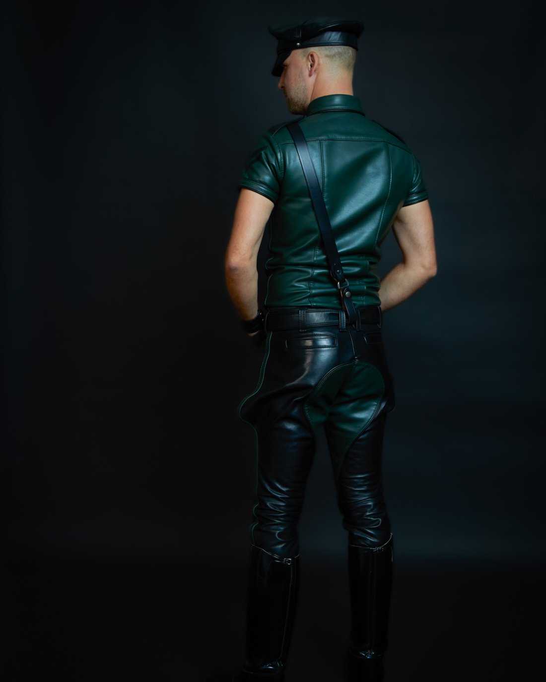 Custom-made short-sleeved leather shirt made of dark green leather with chest pockets