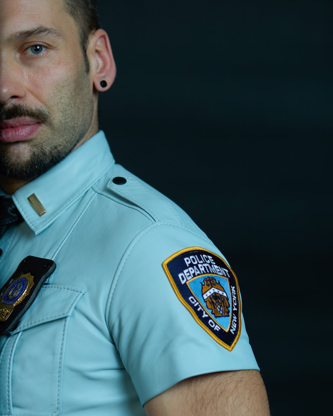 Light blue short-sleeved leather shirt with chest pockets